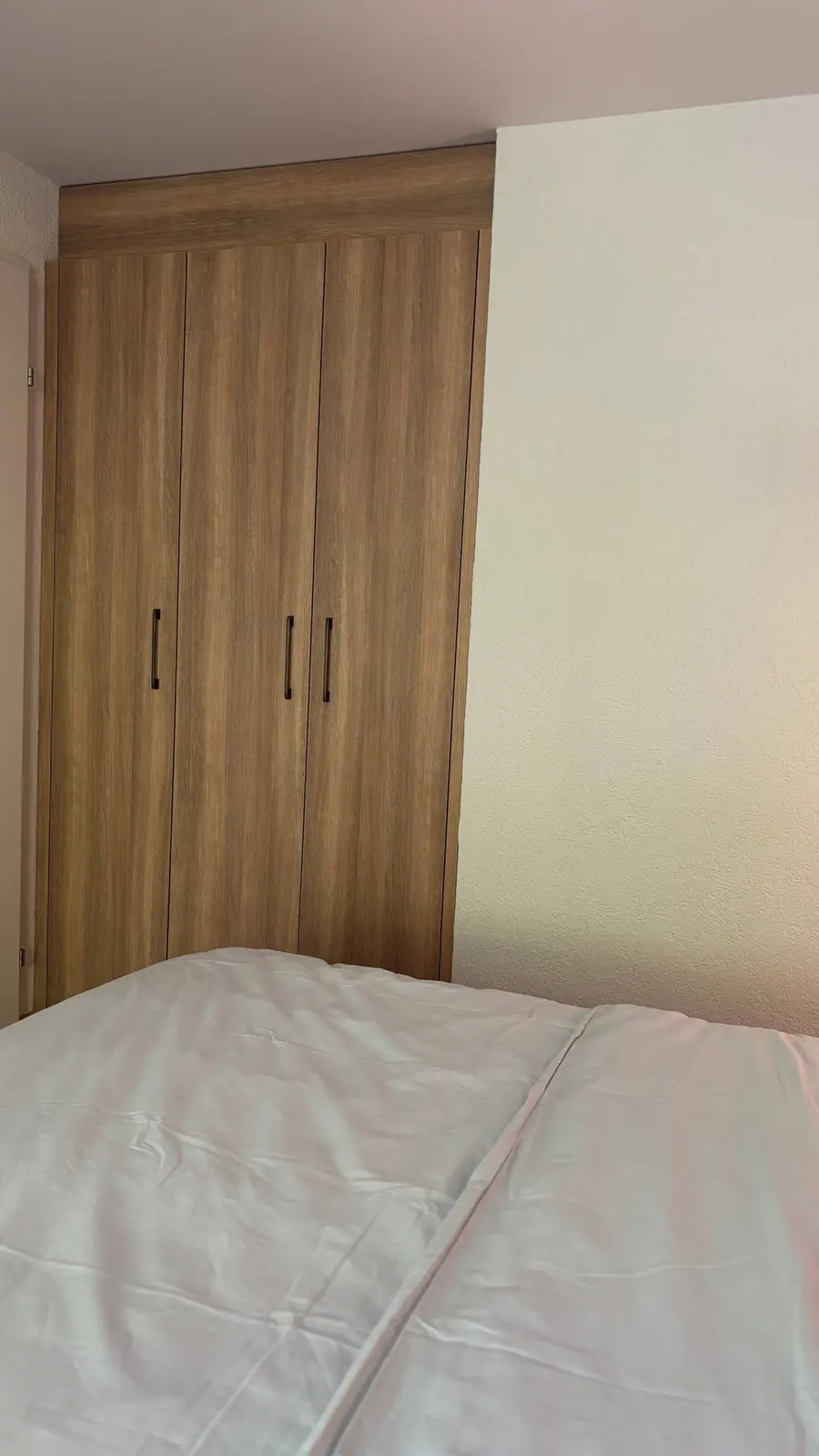 Bedroom with double bed and wardrobe