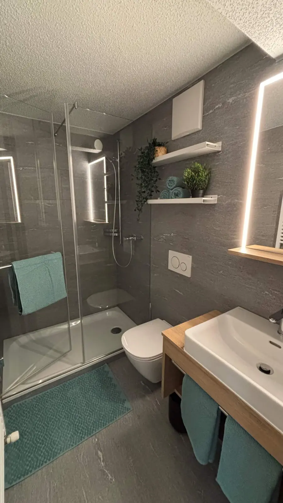 Bathroom with shower, sink and toilet